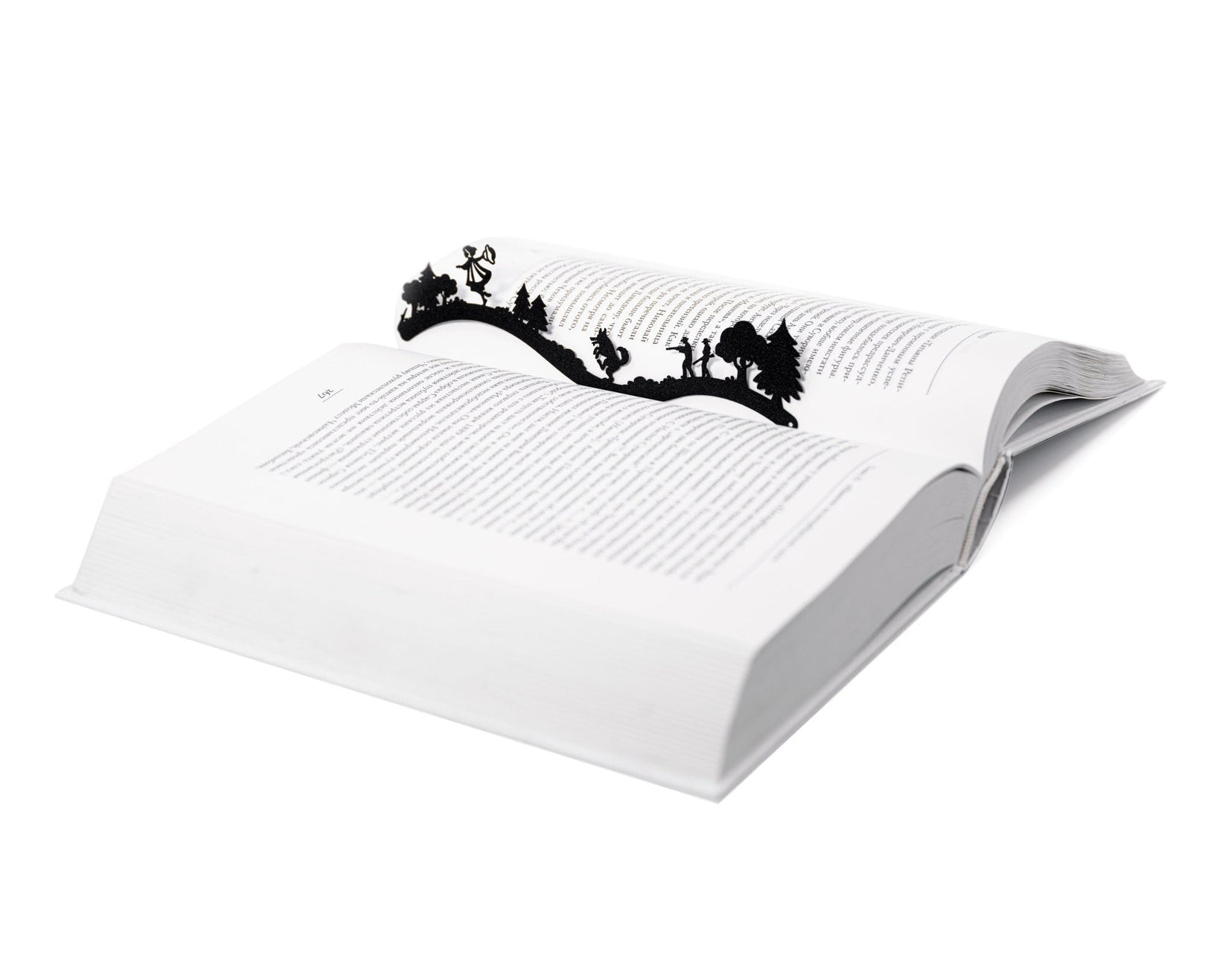 Little Red Riding Hood metal bookmark resting on the pages of an open book, view 5