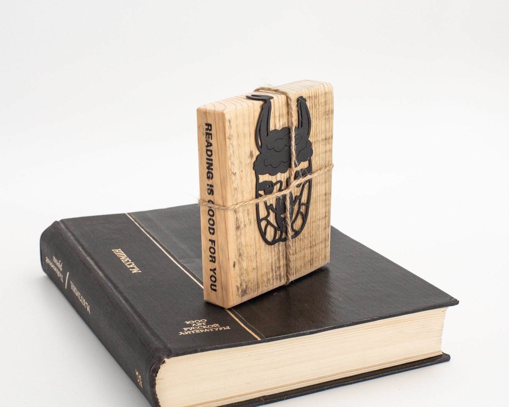 Llama metal bookmark with the engraved wooden gift block it ships with