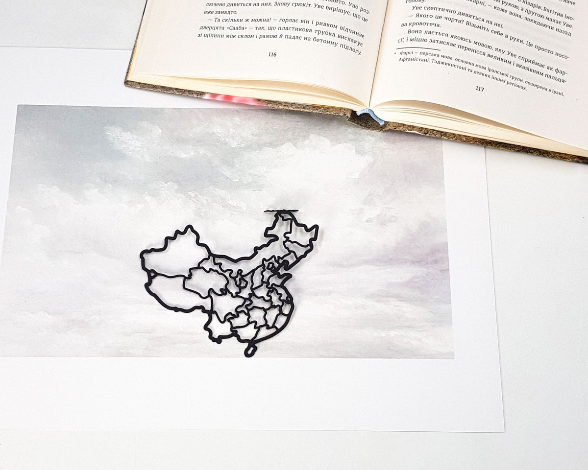 Map of China metal bookmark on a coloured background