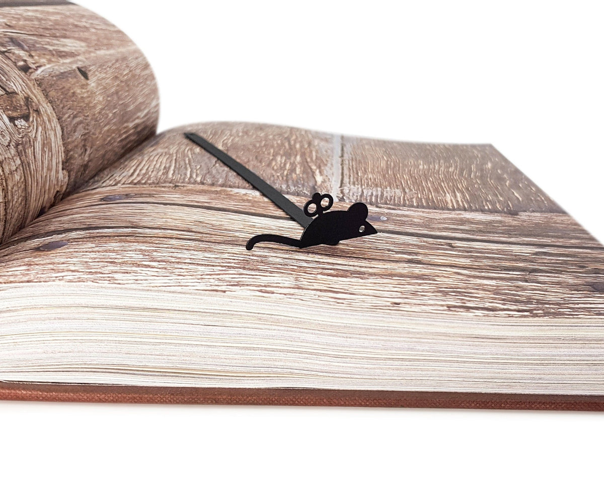 Mechanical Mouse metal bookmark on an illustrated page
