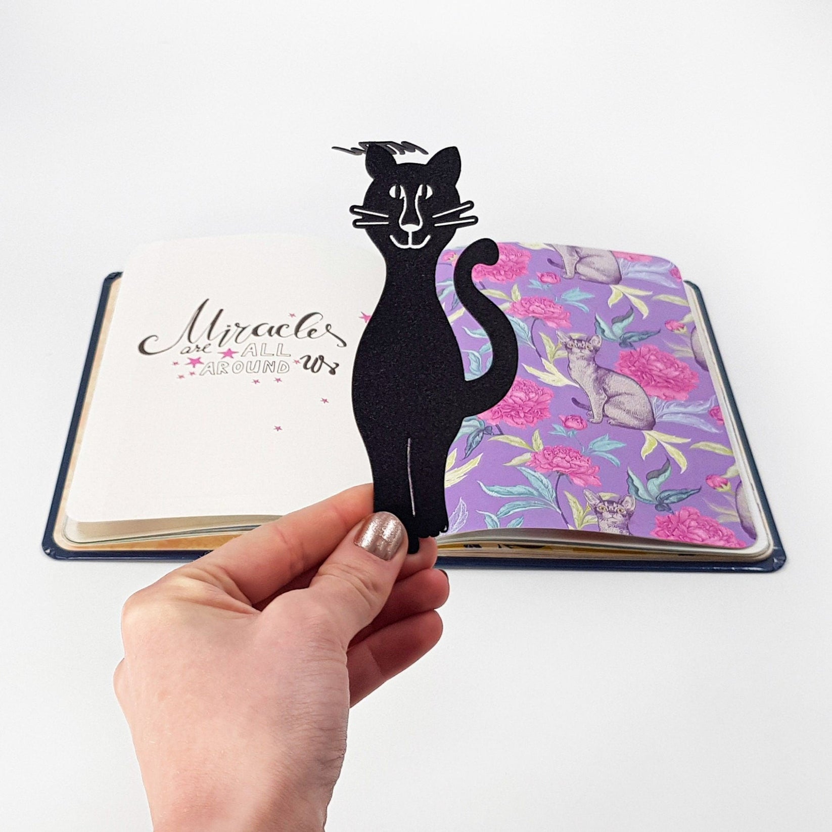 Mew Smiling Cat Bookmark - Whimsical and Cheerful Design for Cat Lovers and Avid Readers - Atelier Article
