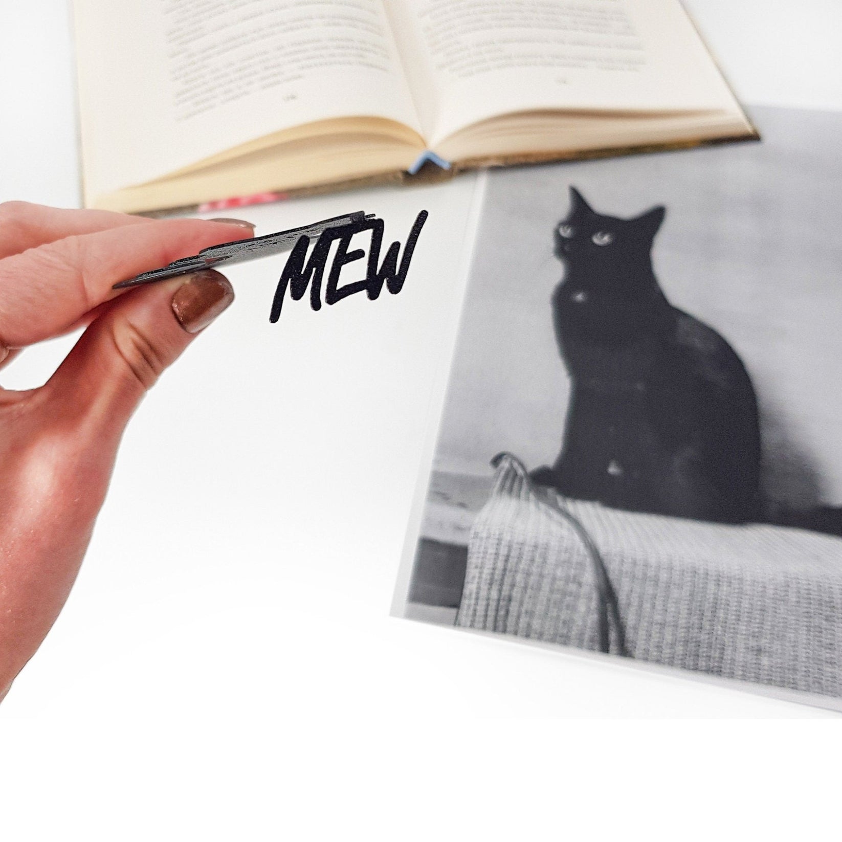Mew Smiling Cat Bookmark - Whimsical and Cheerful Design for Cat Lovers and Avid Readers - Atelier Article