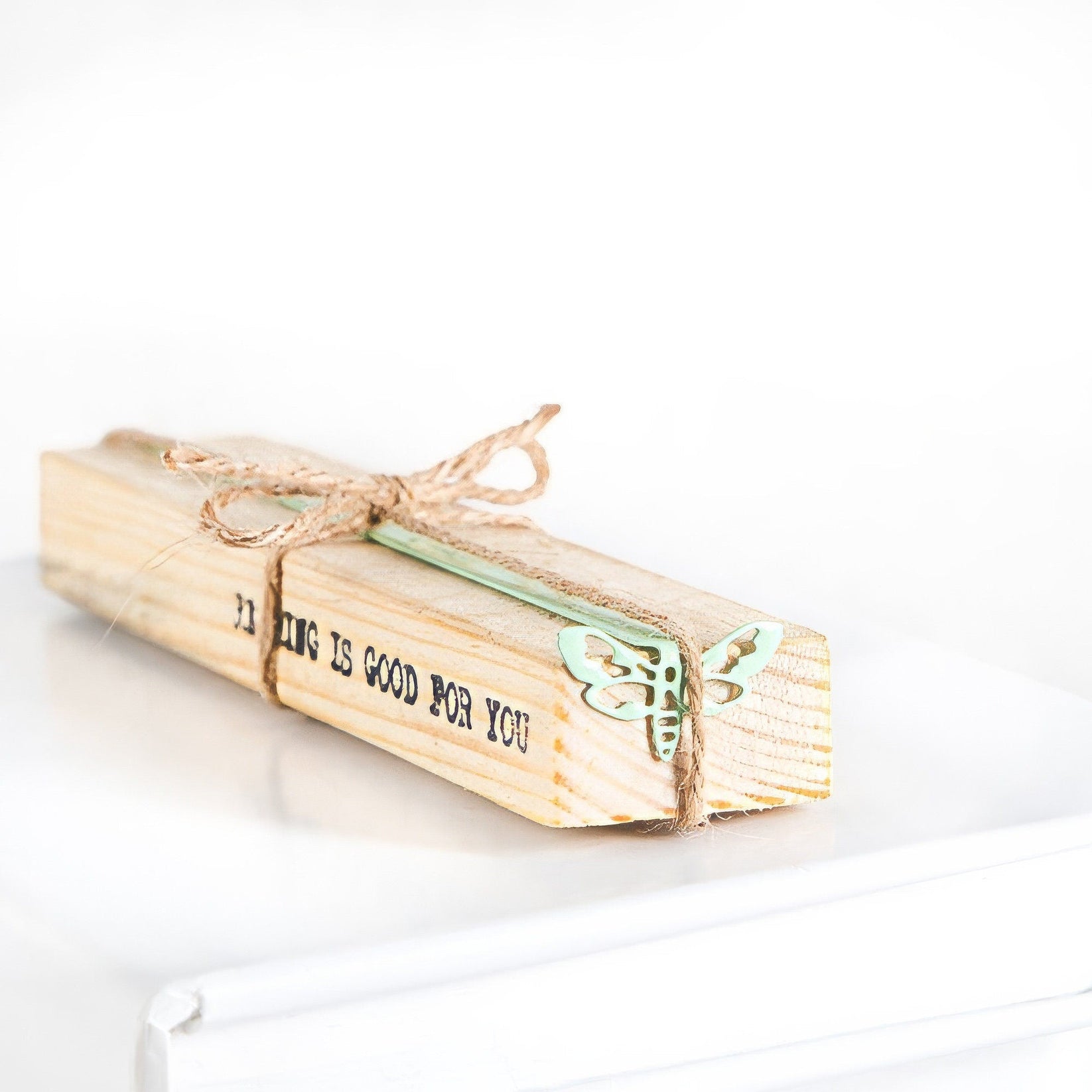 Moth metal bookmark with the engraved wooden gift block it ships with