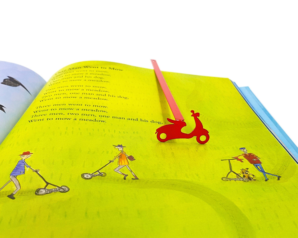 Motor Scooter metal bookmark in red marking a page in an illustrated book