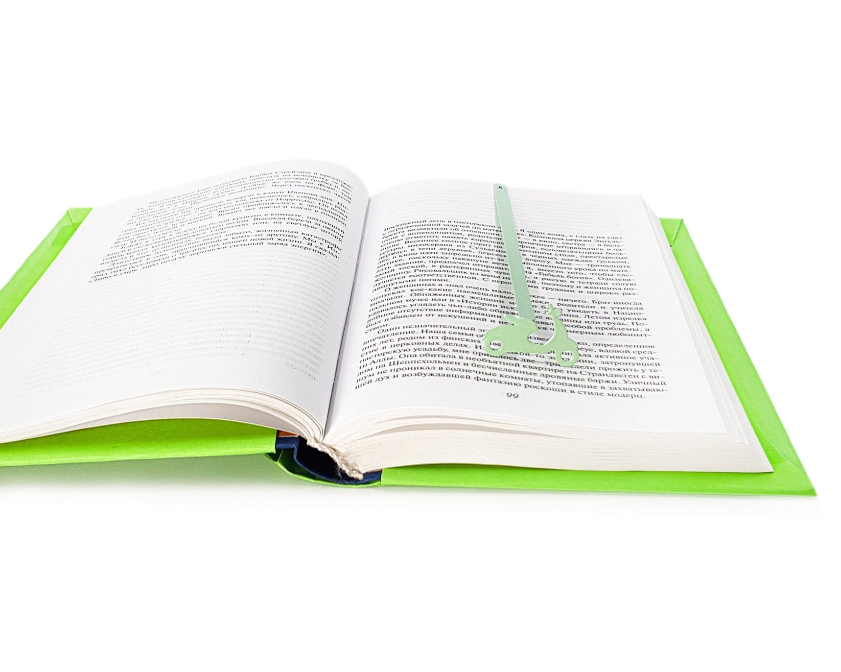 Motor Scooter metal bookmark in green set into the gutter of an open book
