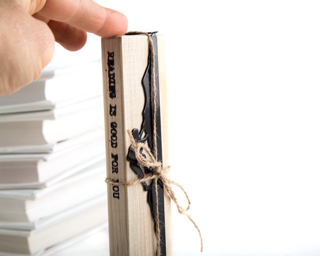 Mountain Climber metal bookmark packed with kraft paper and twine as a gift