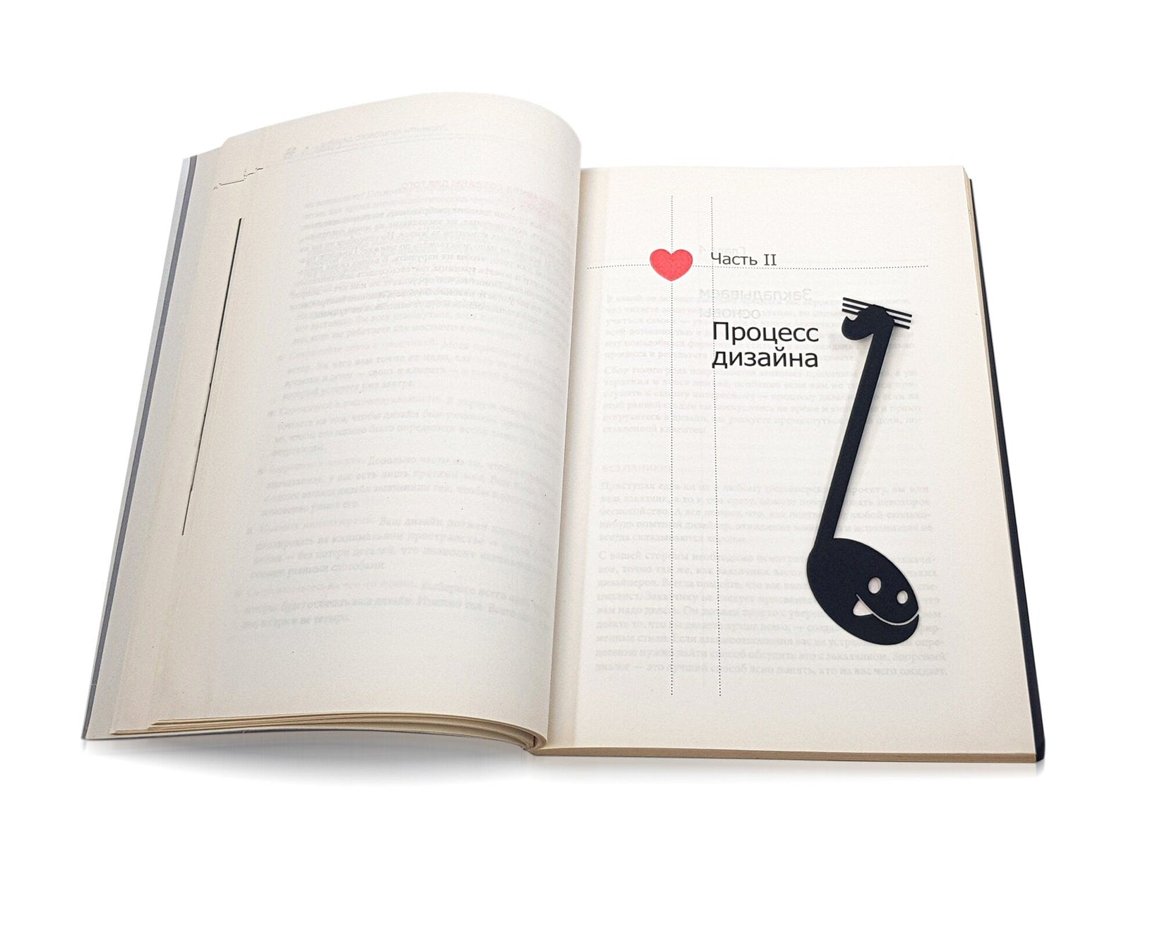 Musical Note metal bookmark marking a page in an open book