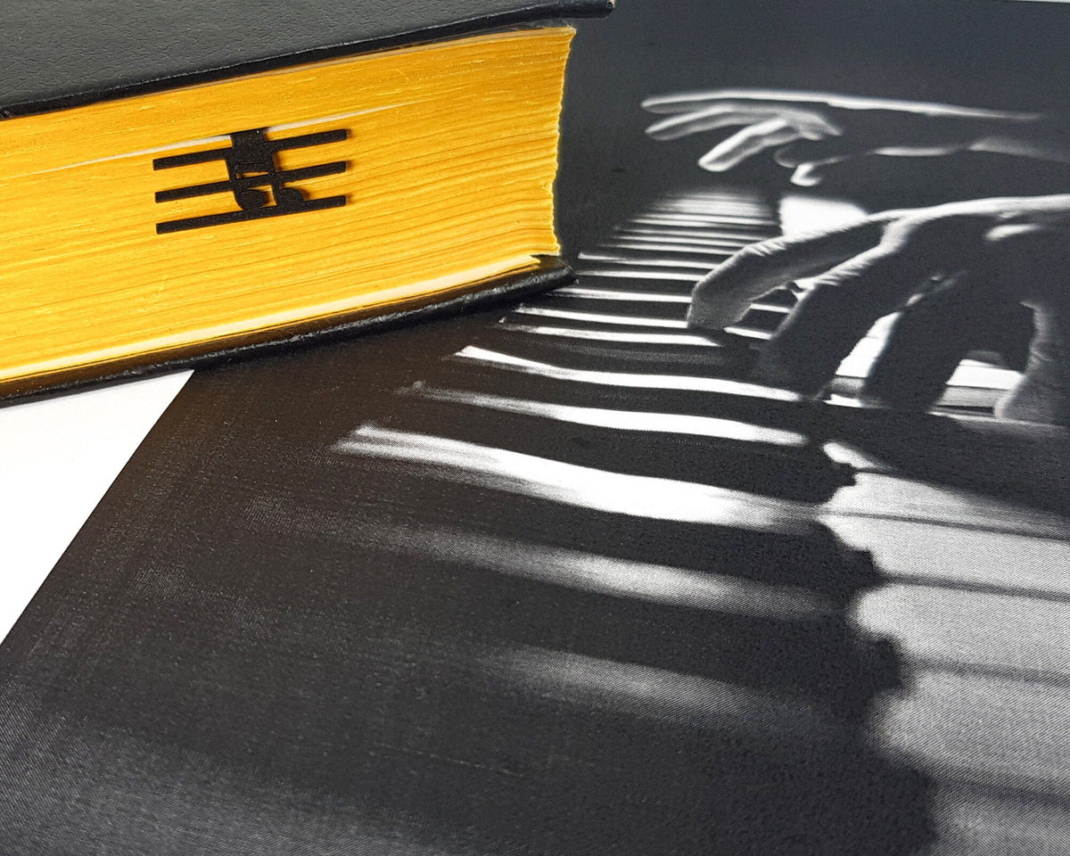 Musical Note metal bookmark on a coloured background