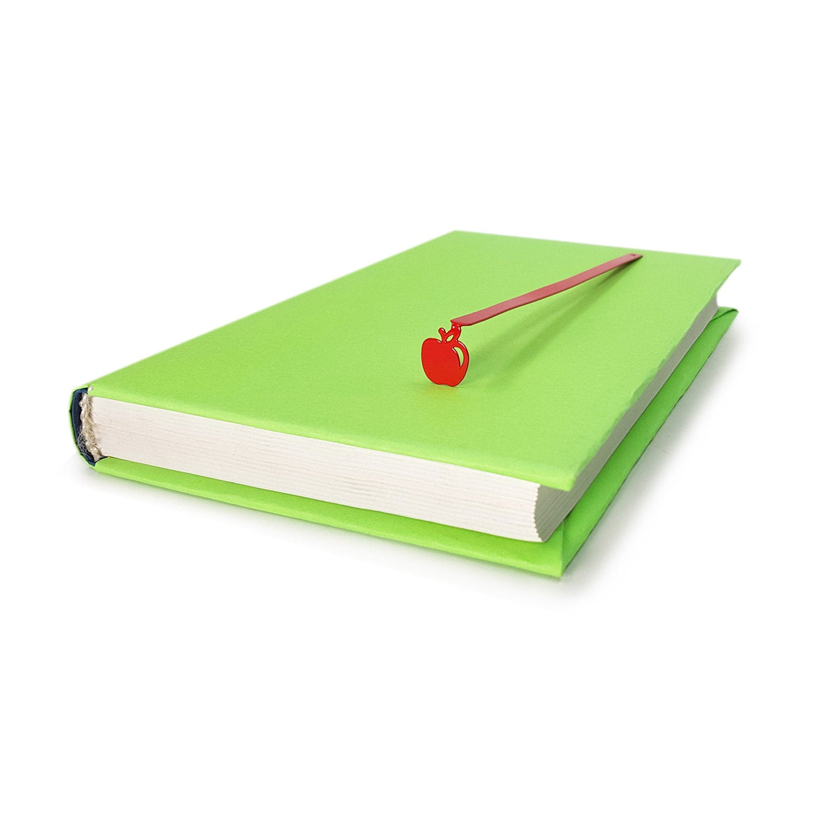 Paradise Apple' metal bookmark in red seen from the edge of a closed book