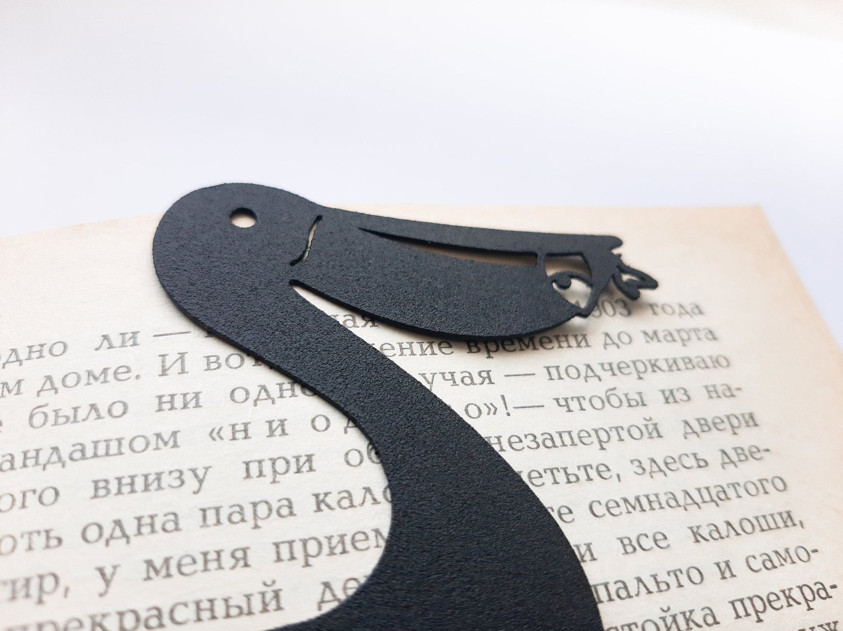 Pelican metal bookmark close-up of the laser-cut detail