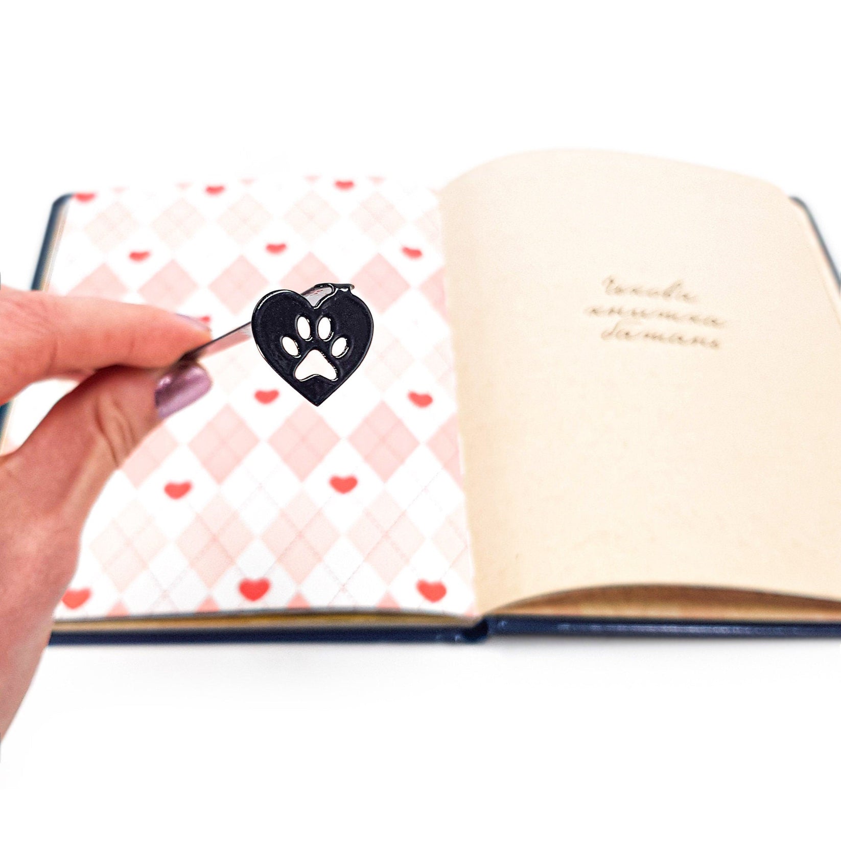 Pet Love metal bookmark on a coloured background
