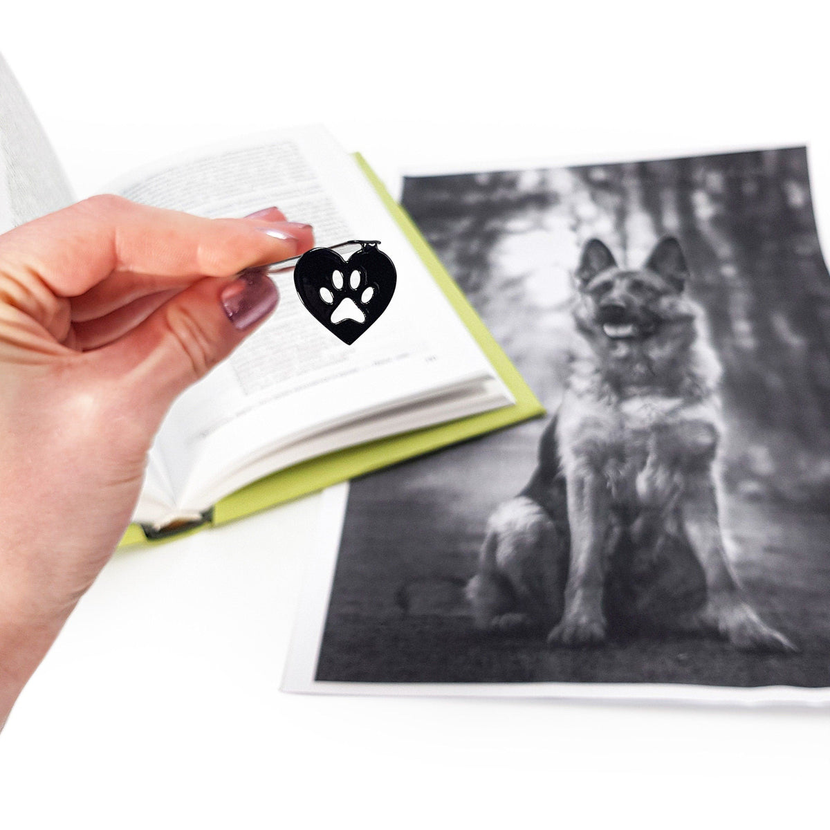 Pet Love metal bookmark on an illustrated page