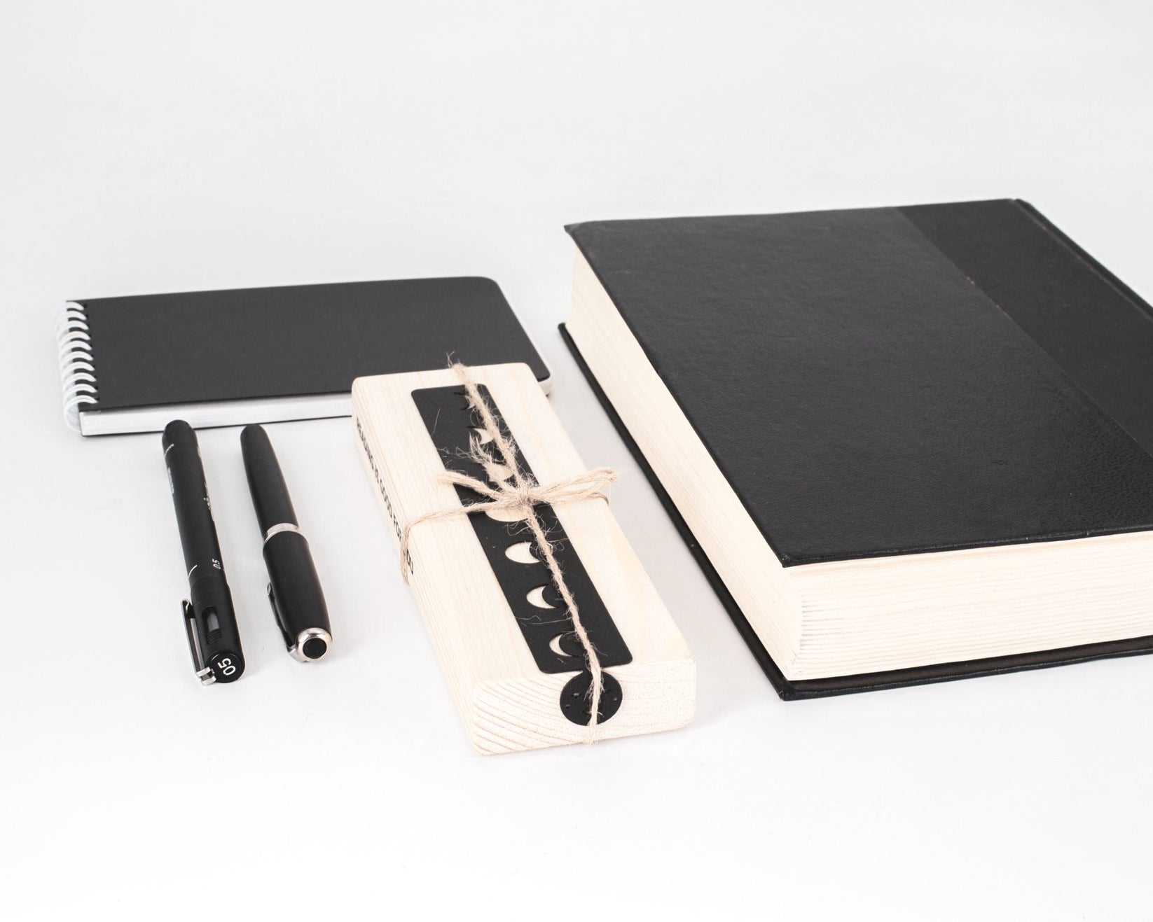 Phases of the Moon metal bookmark packed with kraft paper and twine as a gift