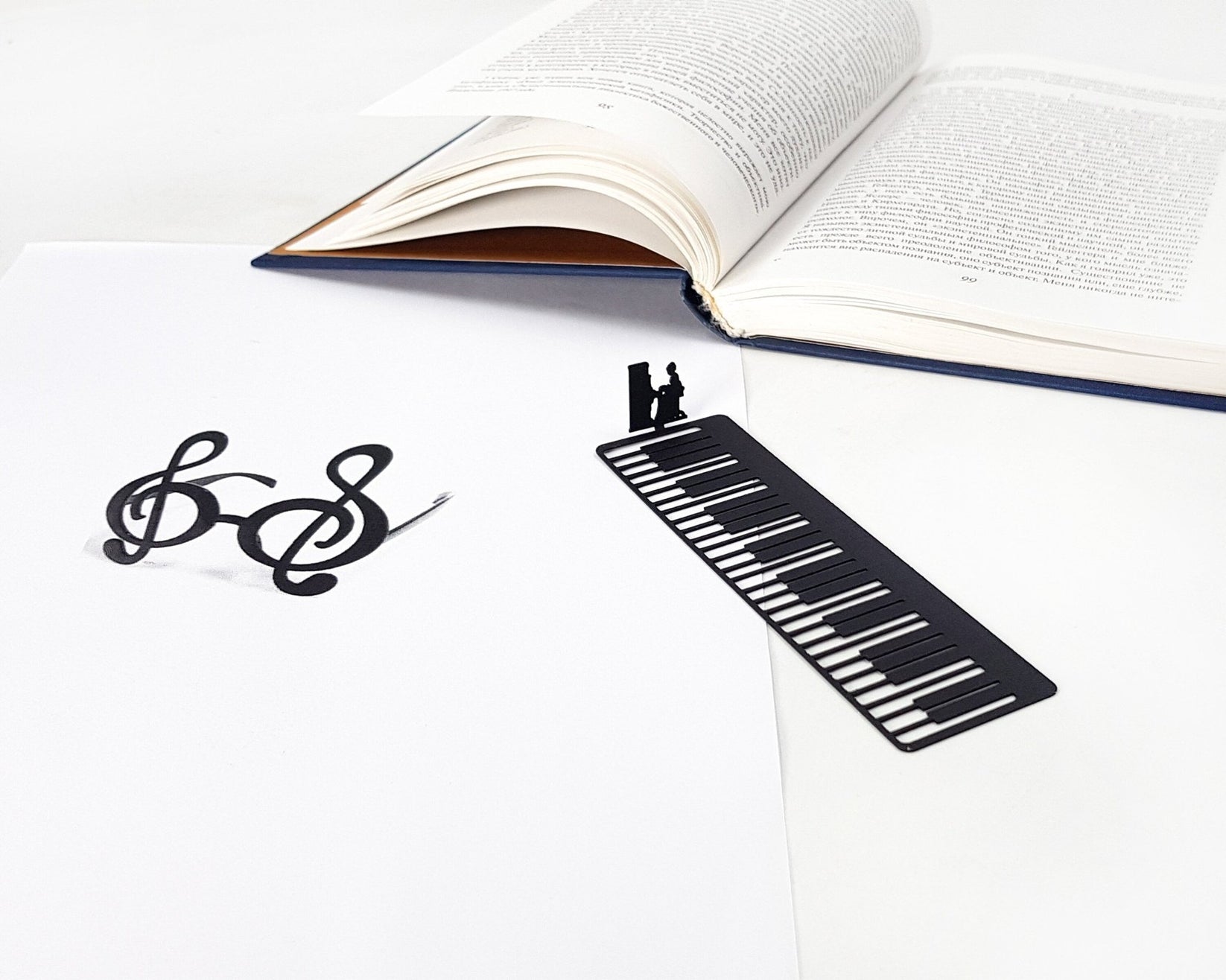 Piano Player metal bookmark shown flat on a white background