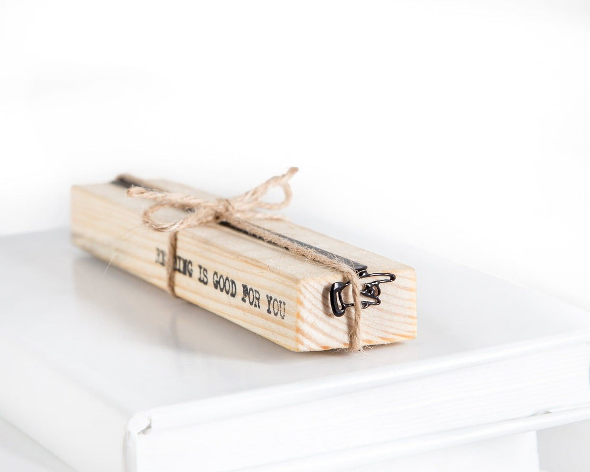 Pointing Finger metal bookmark with the engraved wooden gift block it ships with
