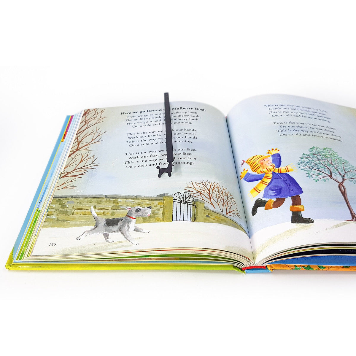 Poodle metal bookmark on an illustrated page