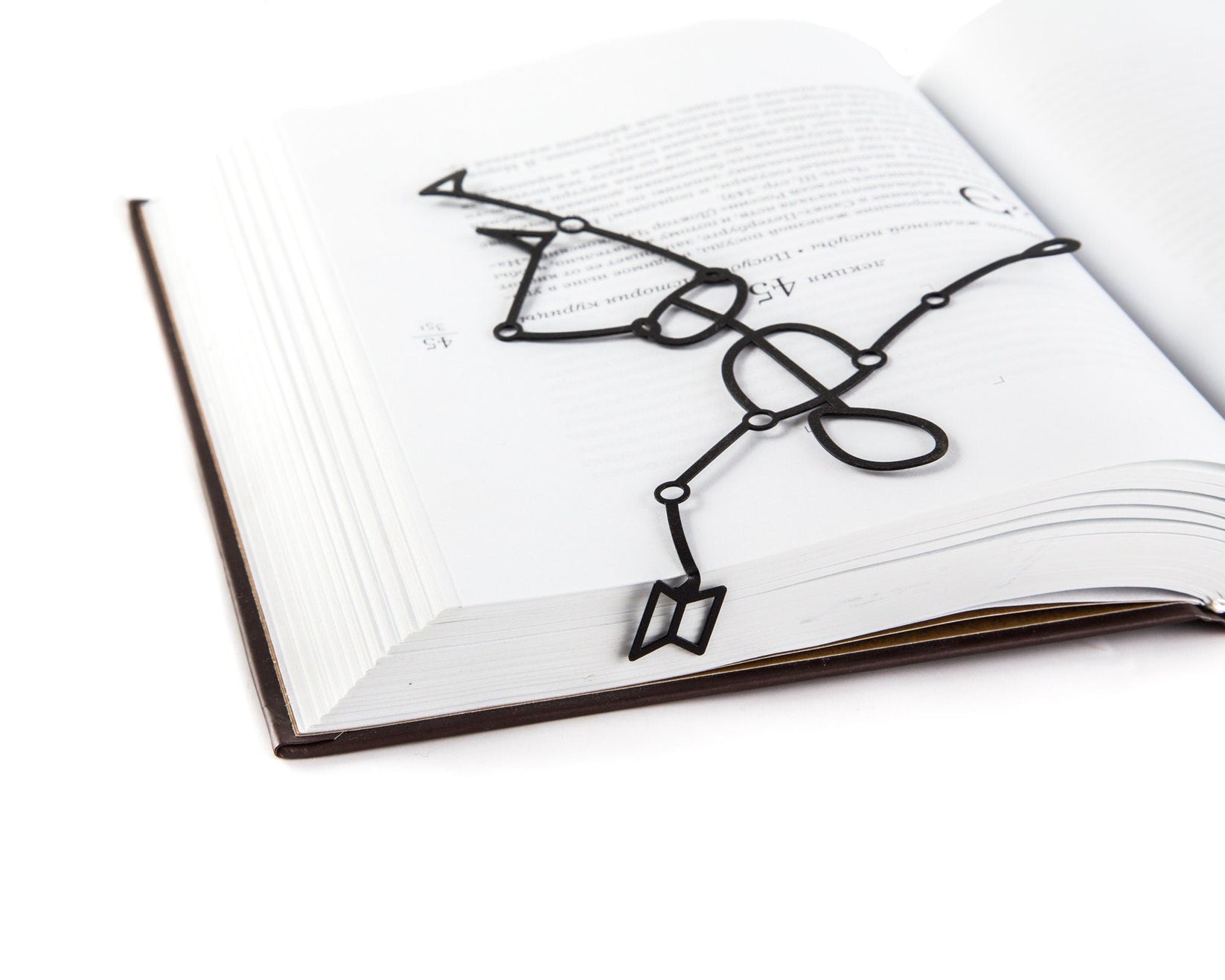 Reading Dummy Model metal bookmark marking a page in an open book