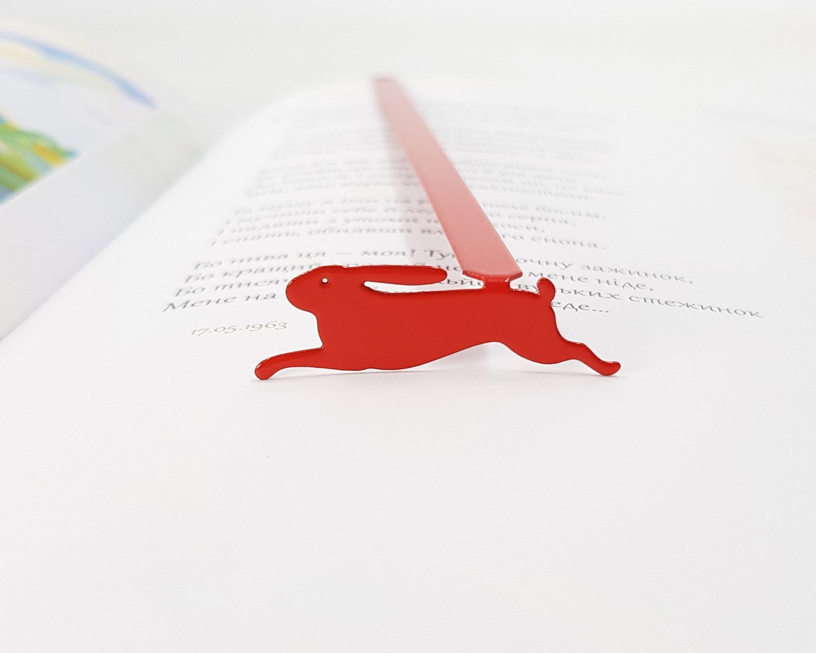 Red Rabbit metal bookmark in red shown flat on a white background