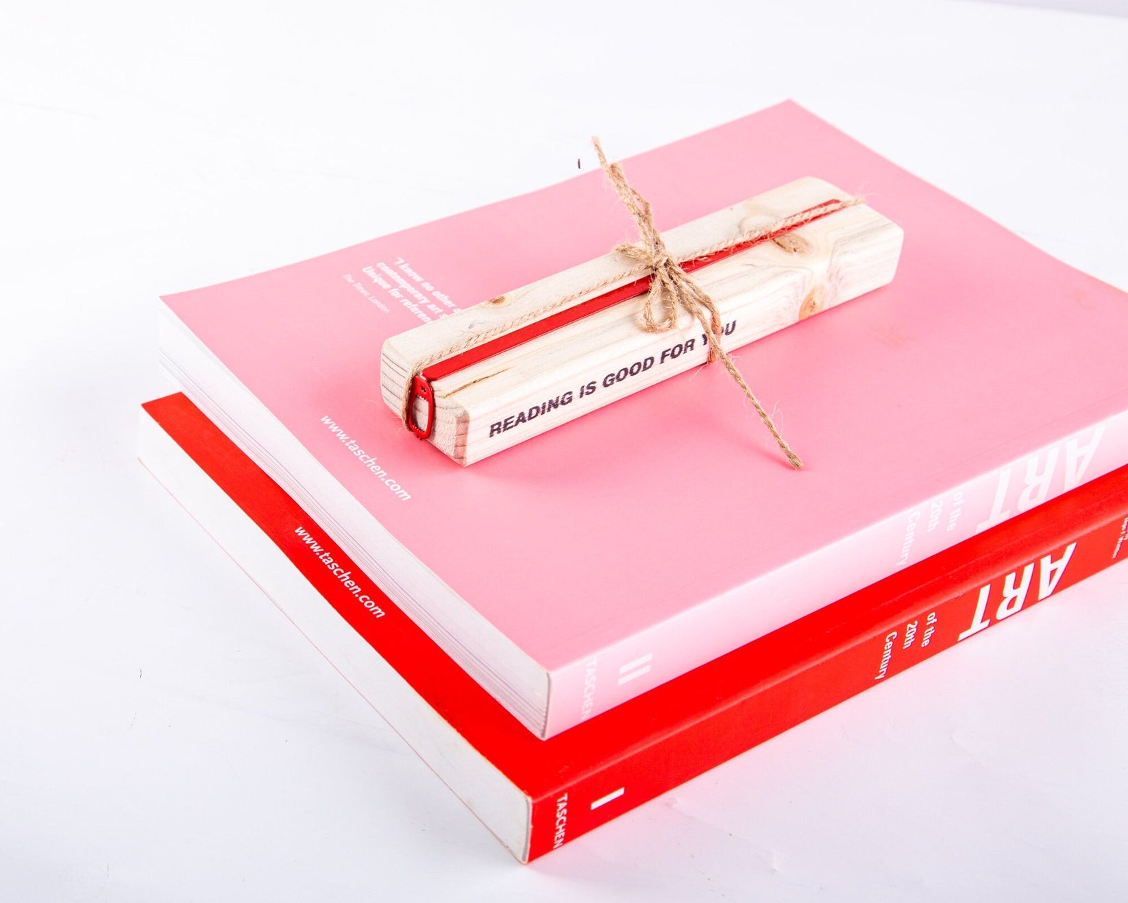 Red Screaming Monster metal bookmark in red with the engraved wooden gift block it ships with
