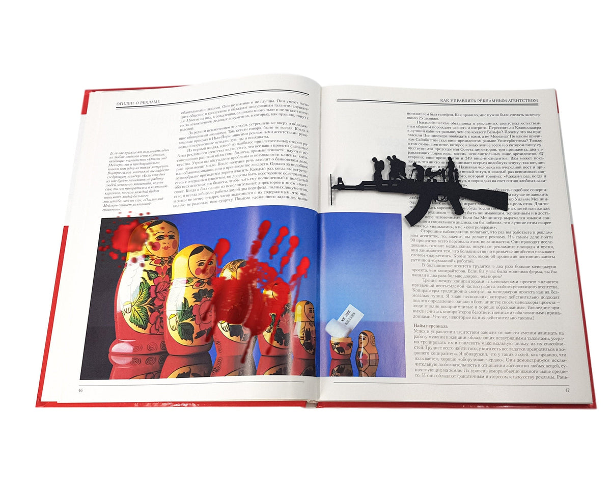 Refugees, No War in Ukraine metal bookmark marking a page in an illustrated book, view 4