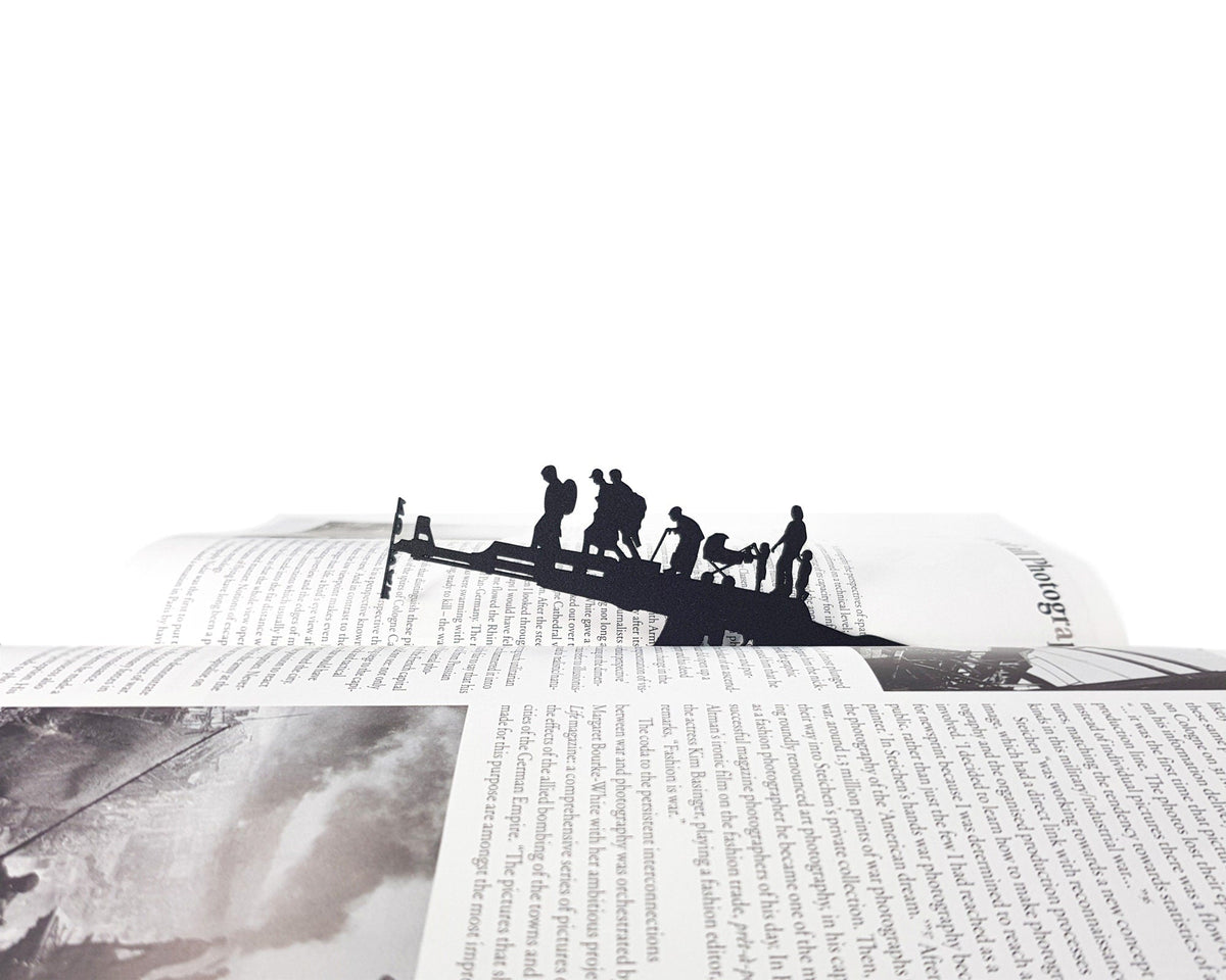 Refugees, No War in Ukraine metal bookmark on an illustrated page