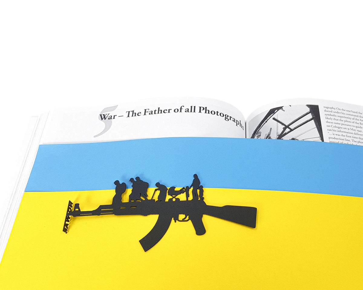 Refugees, No War in Ukraine metal bookmark shot on a coloured surface