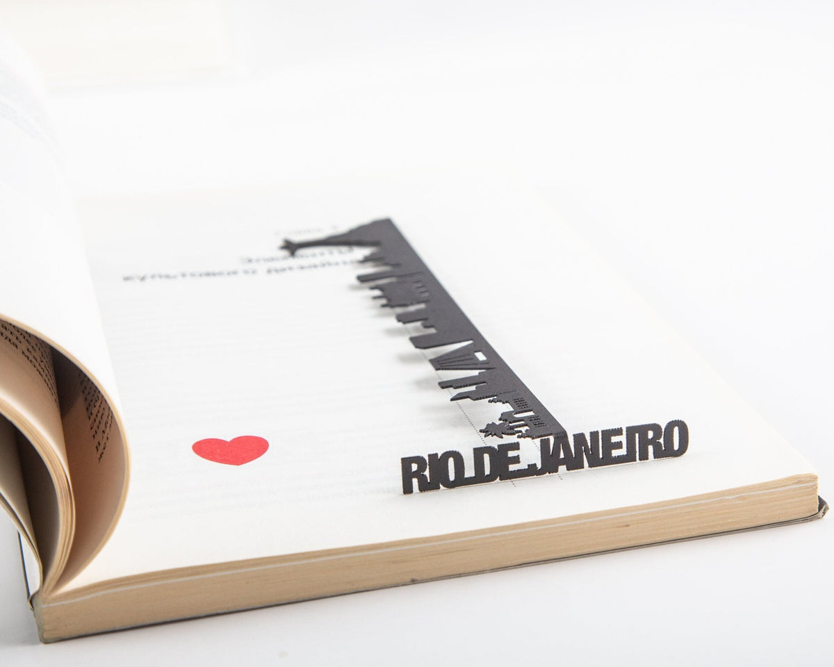 Rio De Janeiro metal bookmark marking a page in a notebook