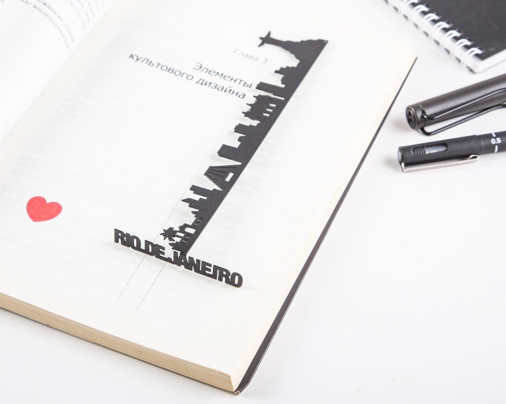 Rio De Janeiro metal bookmark tucked into a notebook