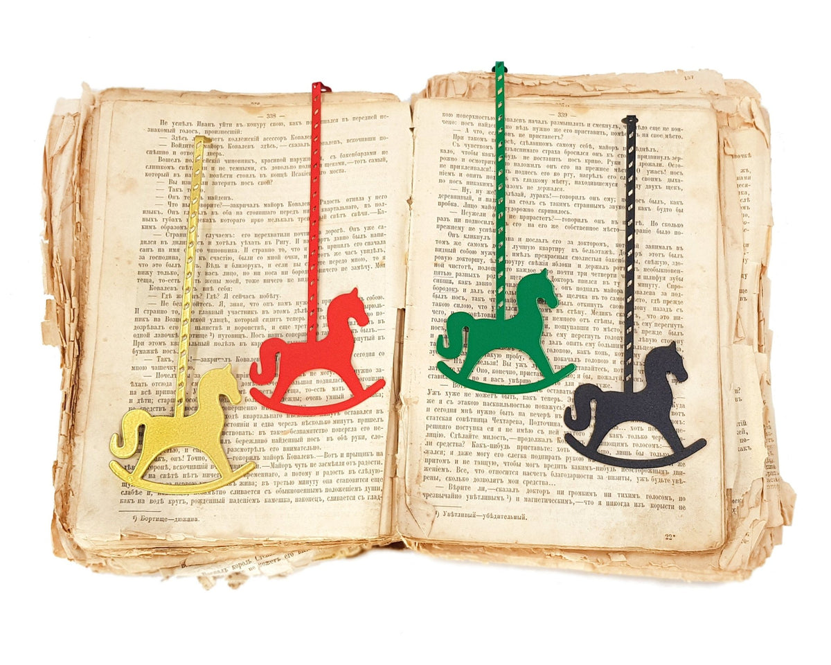 Rocking Horse metal bookmark shown together with other bookmarks from the range