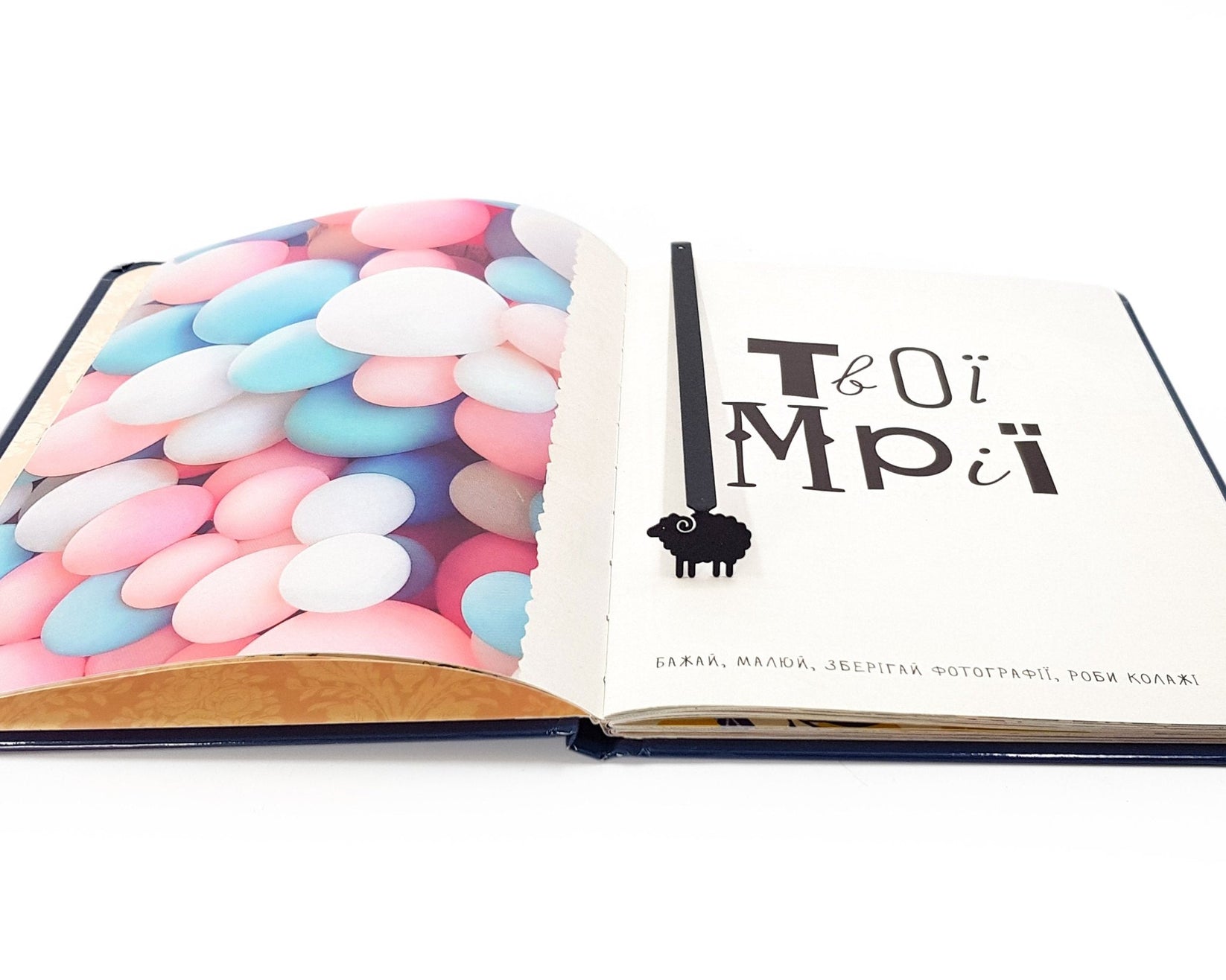 Sheep metal bookmark shot on a coloured surface