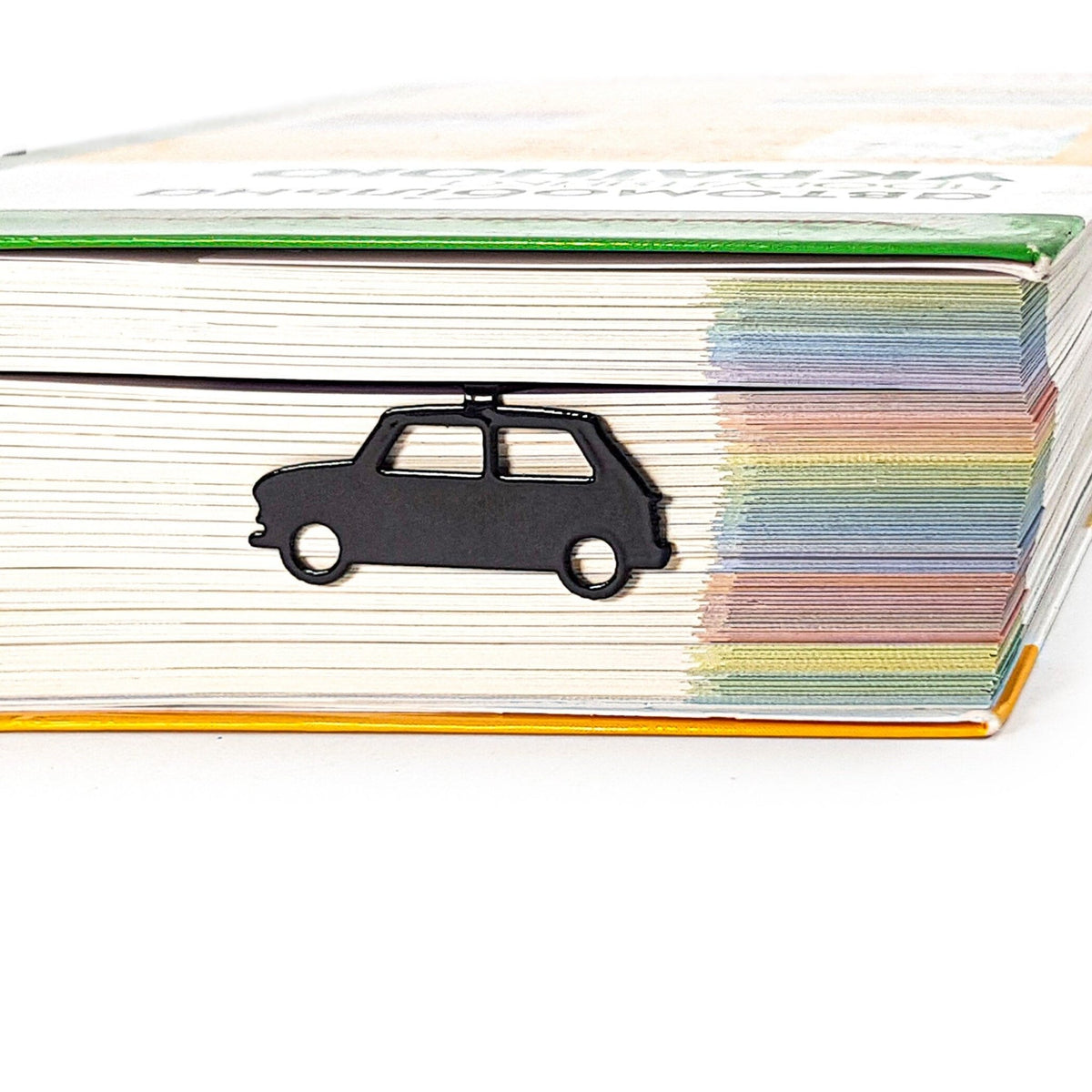 Black Car metal bookmark shown with a stack of books