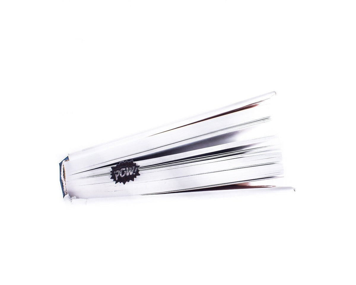 Speech Bubble Pow metal bookmark in red in a closed book, only its top showing above the pages