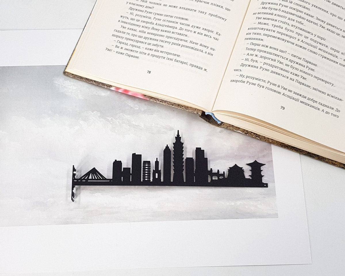 Taipei metal bookmark on a coloured background
