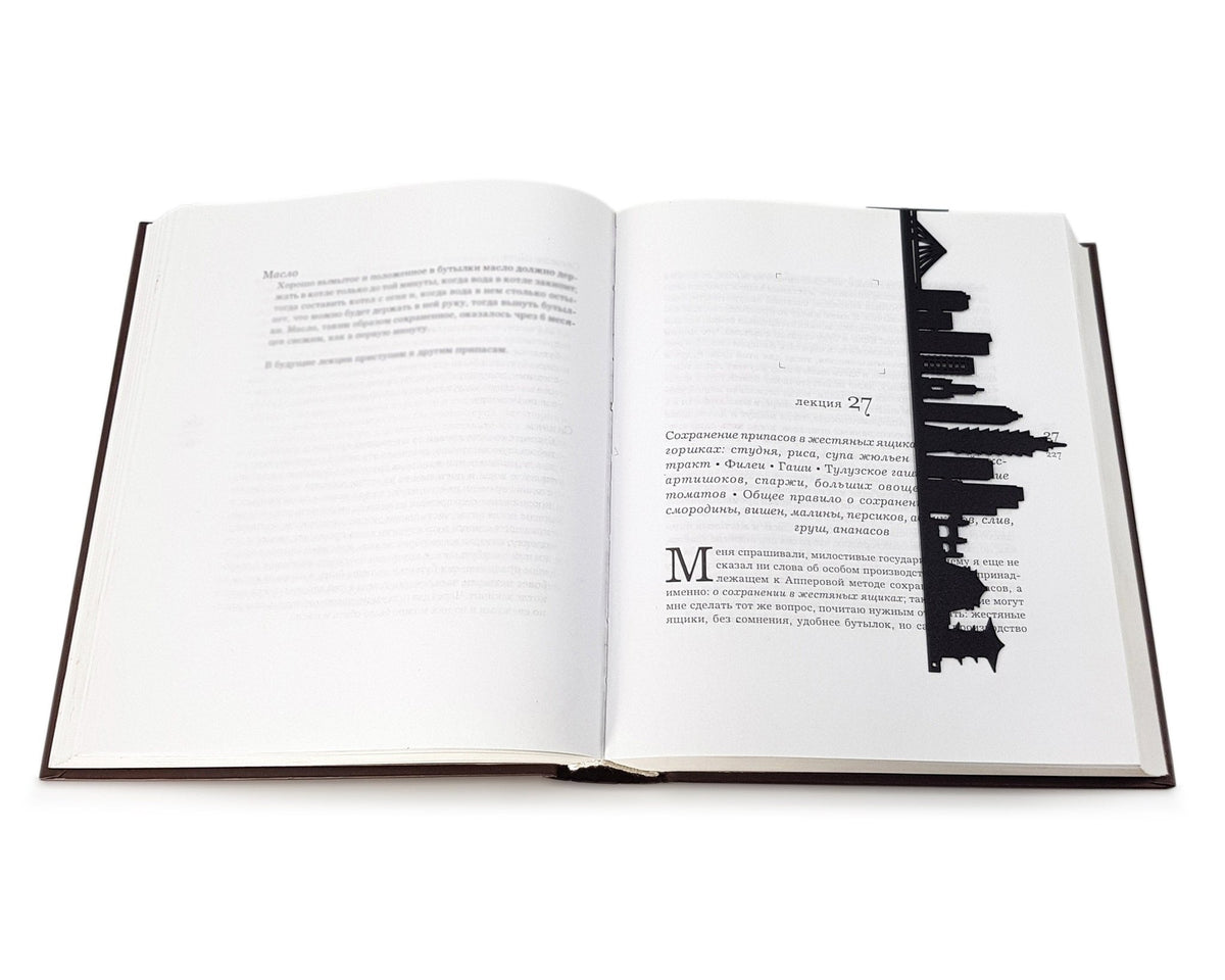 Taipei metal bookmark marking a page in an open book