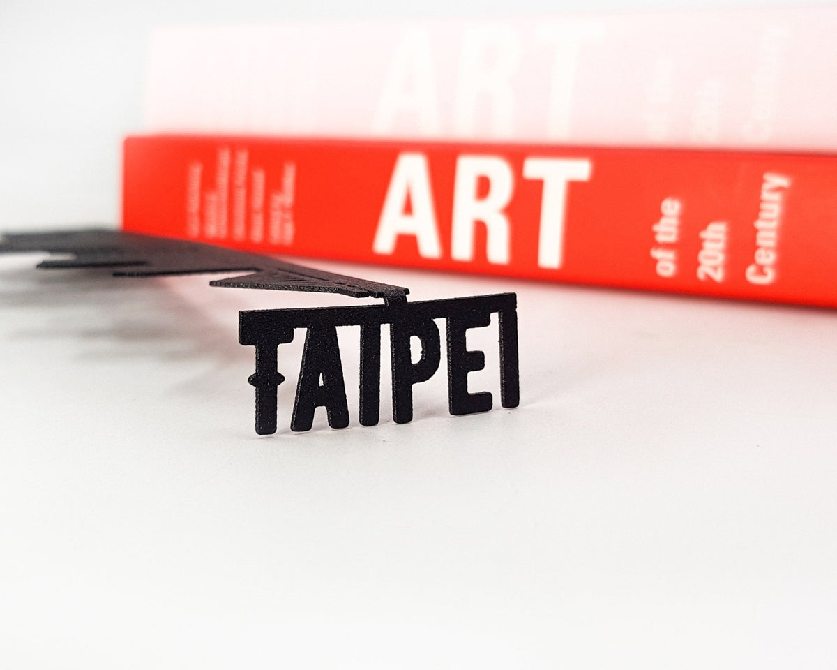 Taipei metal bookmark against a coloured backdrop