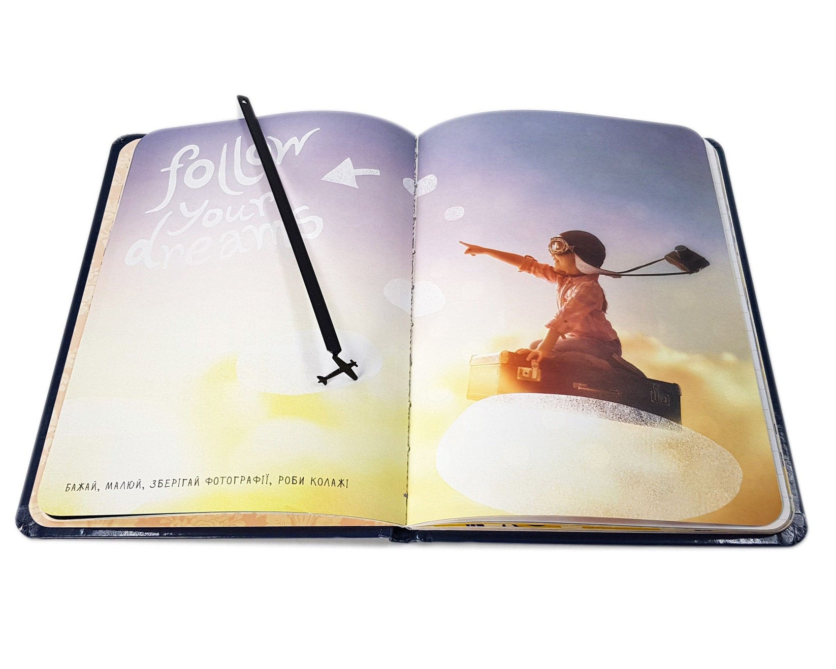 Take a Book Will Fly metal bookmark marking a page in an illustrated book