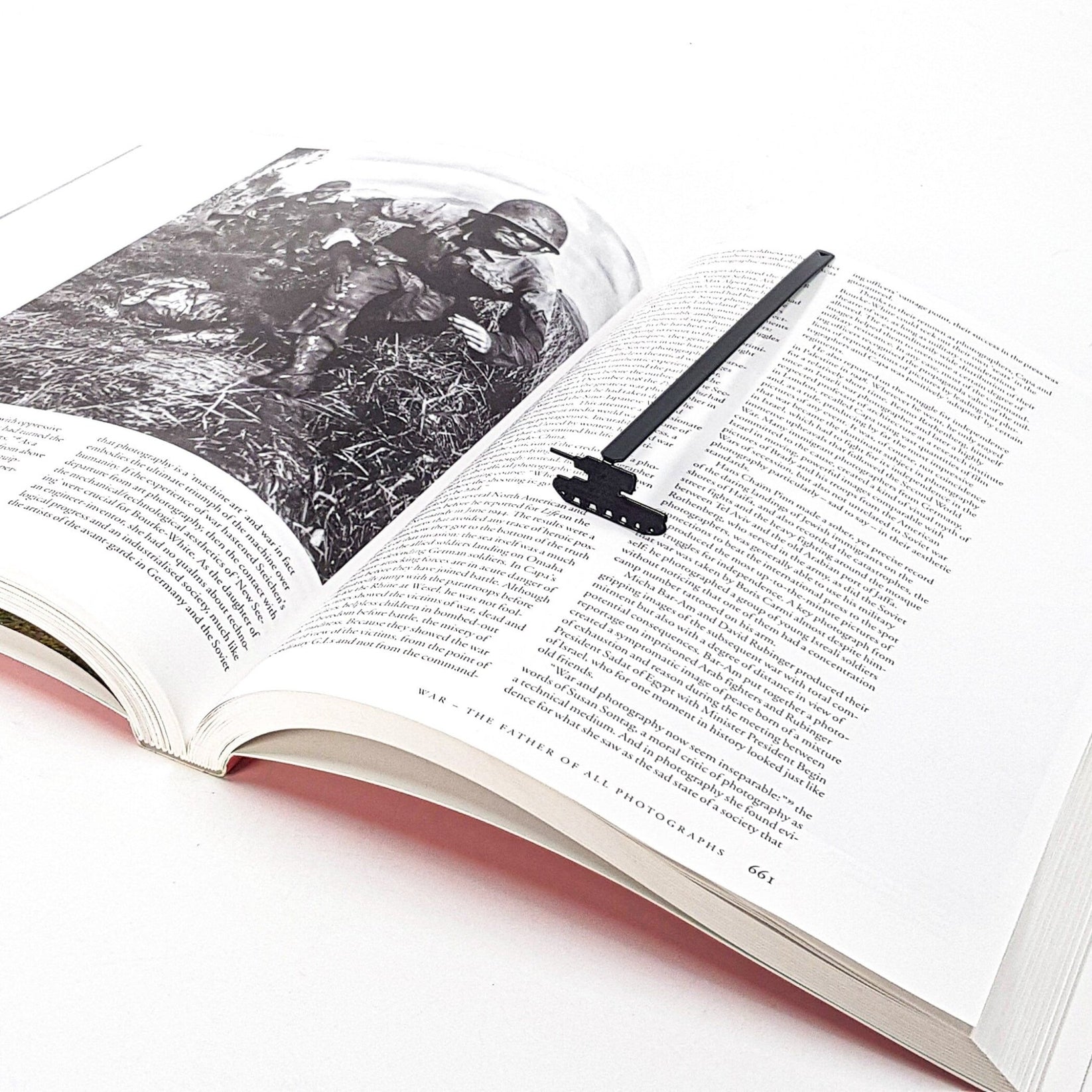 Tank metal bookmark on an illustrated page