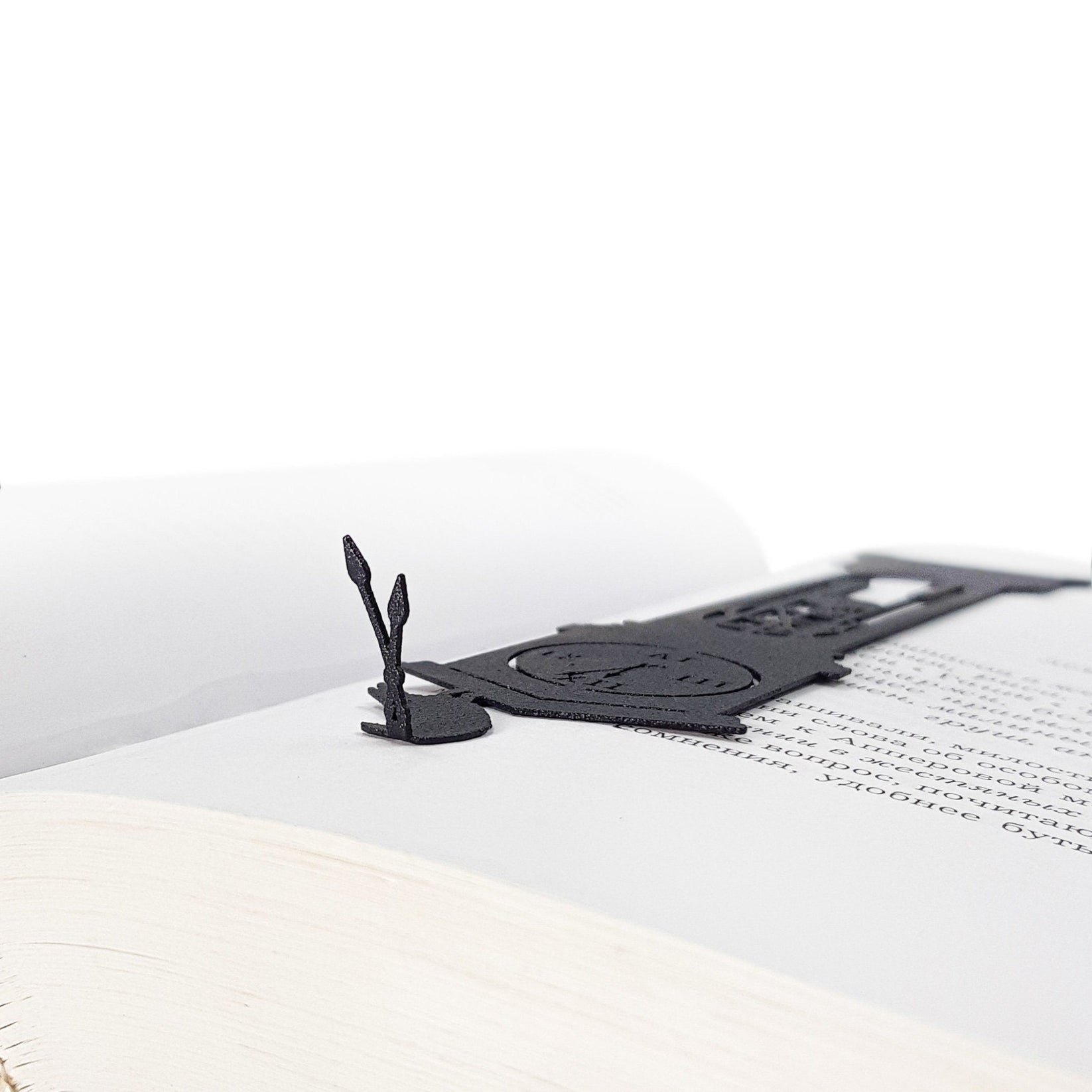 The Raven's Pendulum Dance metal bookmark shown flat on a white background