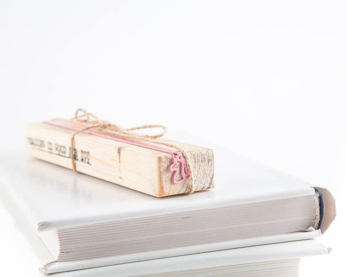 Unicorn metal bookmark in red with the engraved wooden gift block it ships with