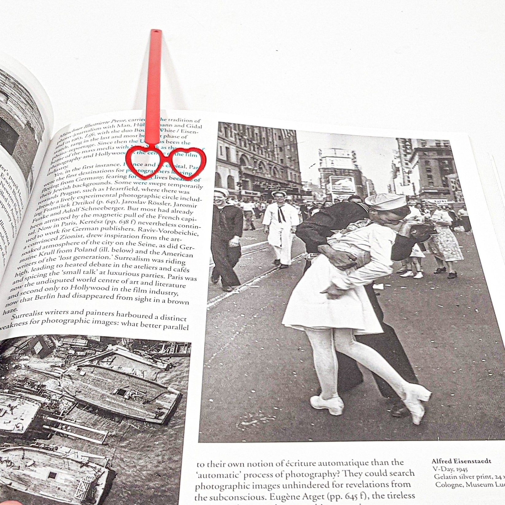 Vision Love metal bookmark in red on an illustrated page, view 5