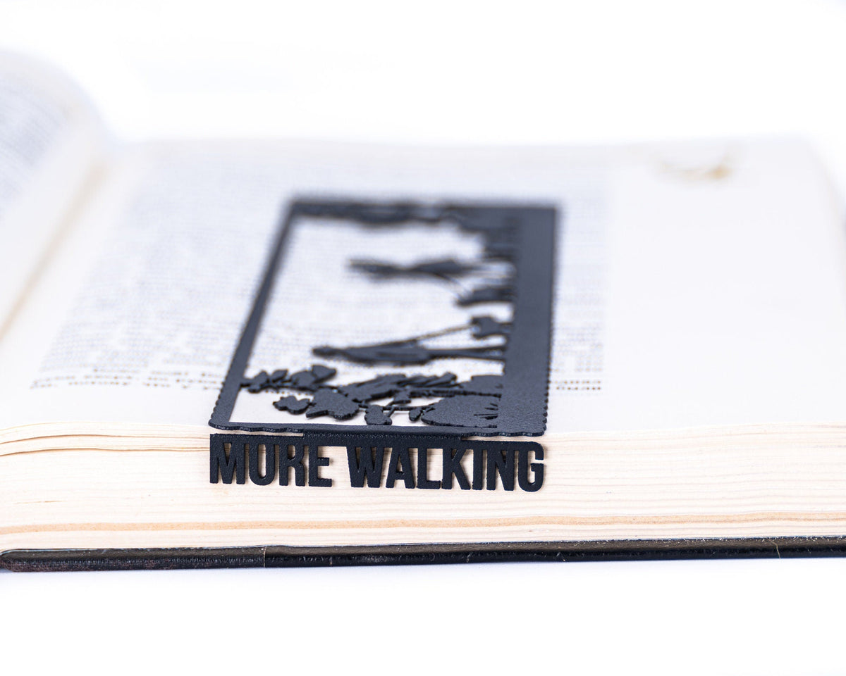Dog Lover metal bookmark set into the gutter of an open book
