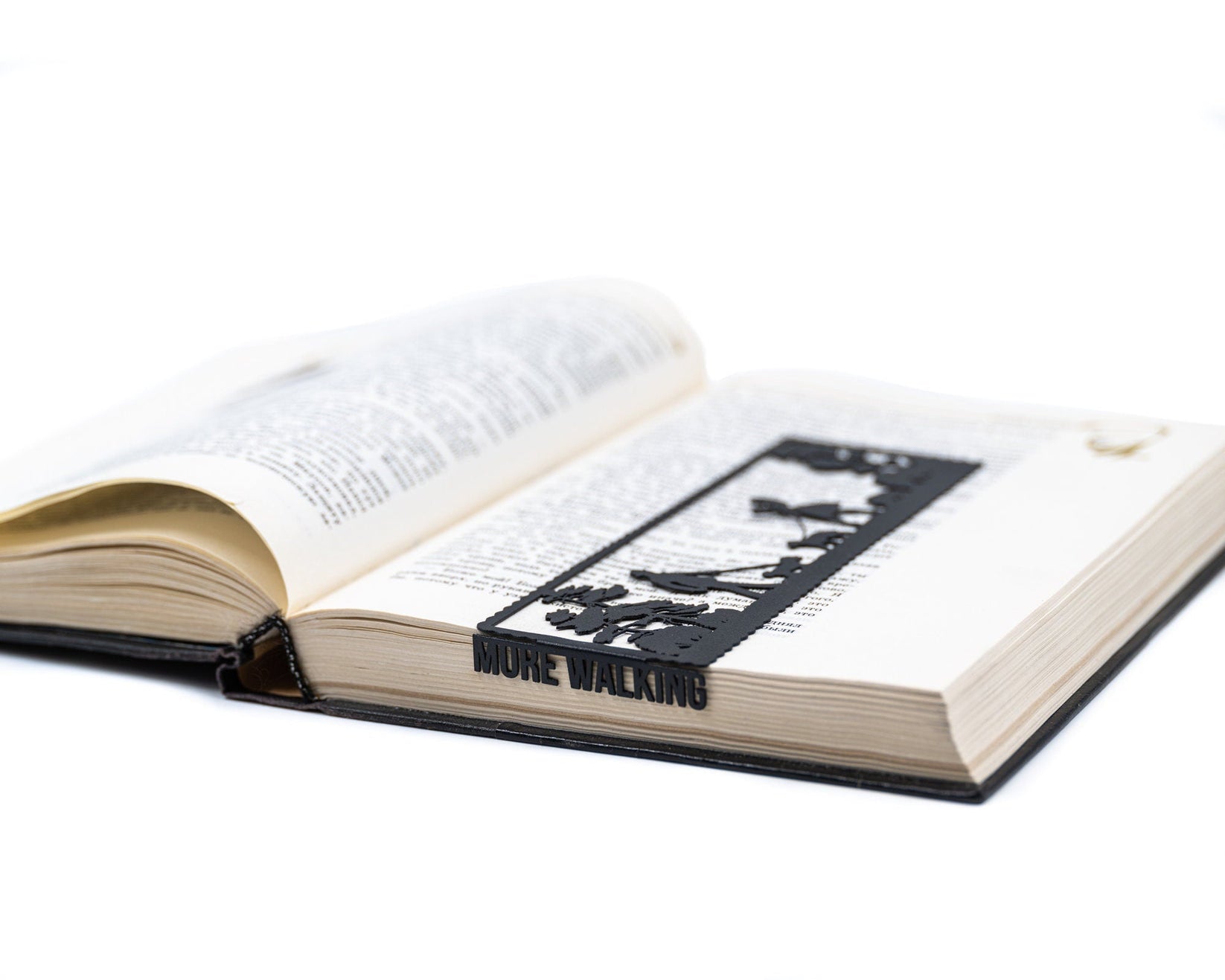 Dog Lover metal bookmark lying across the pages of an open book