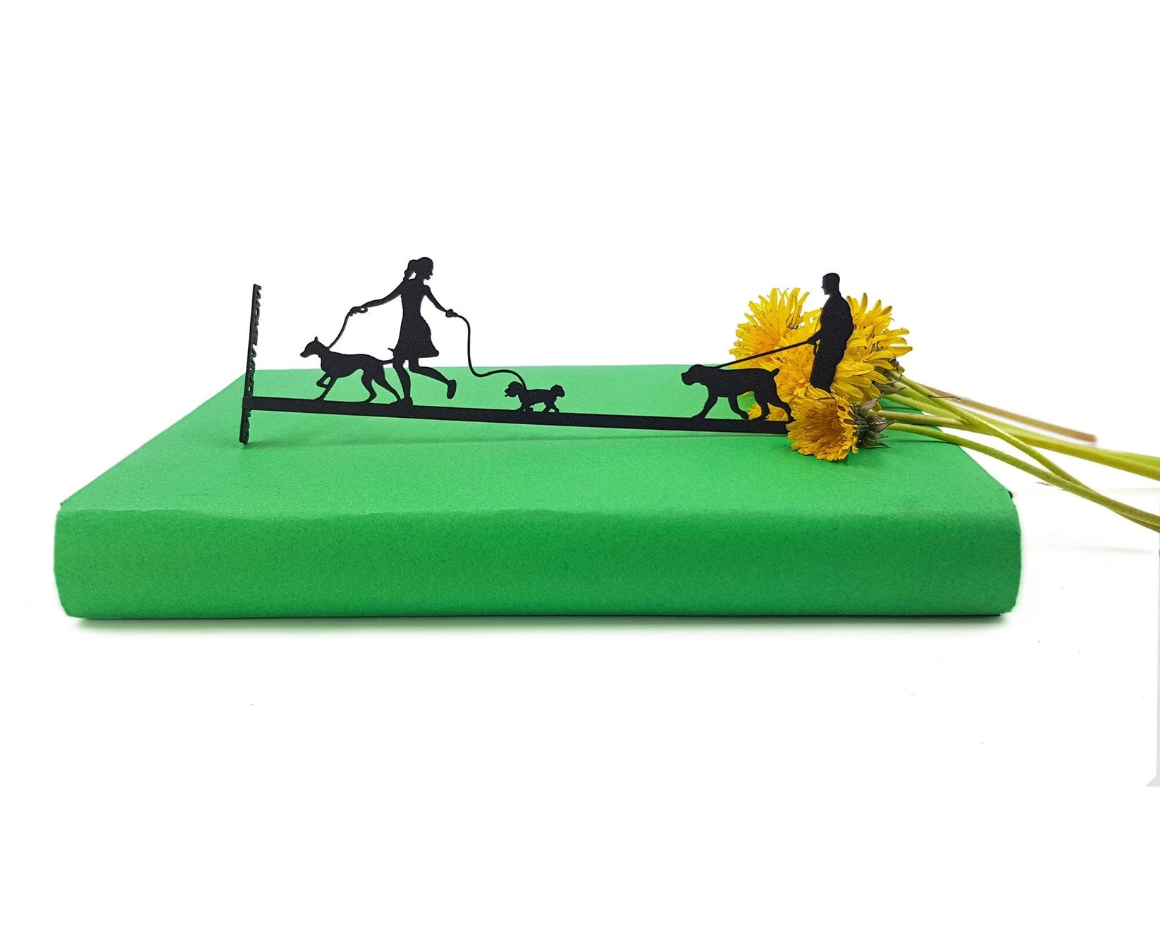 Walking the Dog metal bookmark against a coloured backdrop