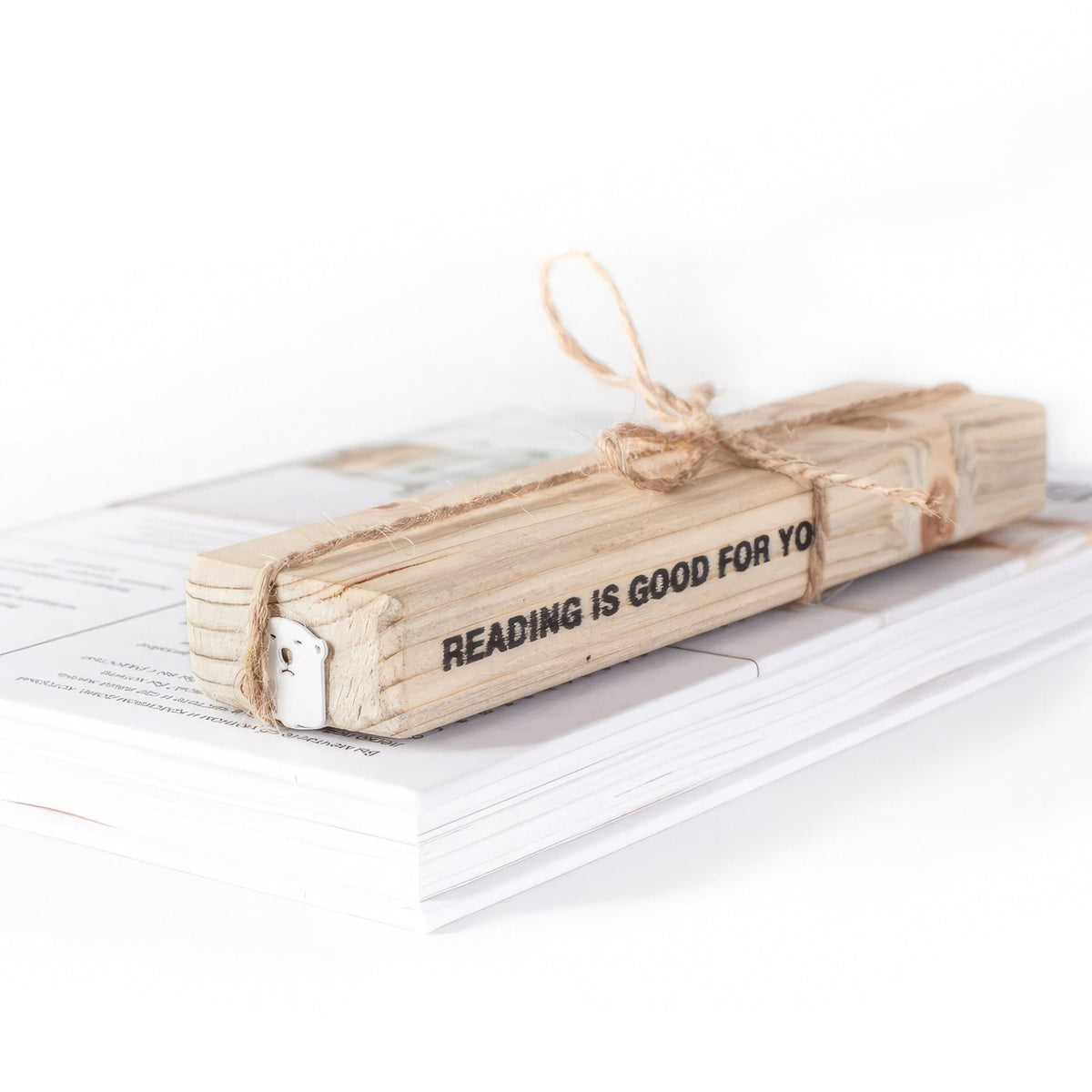 White Bear metal bookmark in white with the engraved wooden gift block it ships with