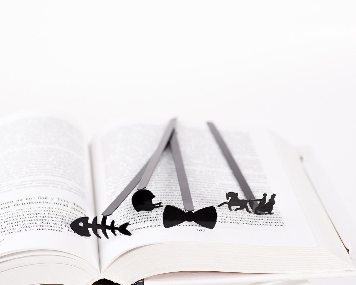 Winter Sleigh metal bookmark shown together with other bookmarks from the range
