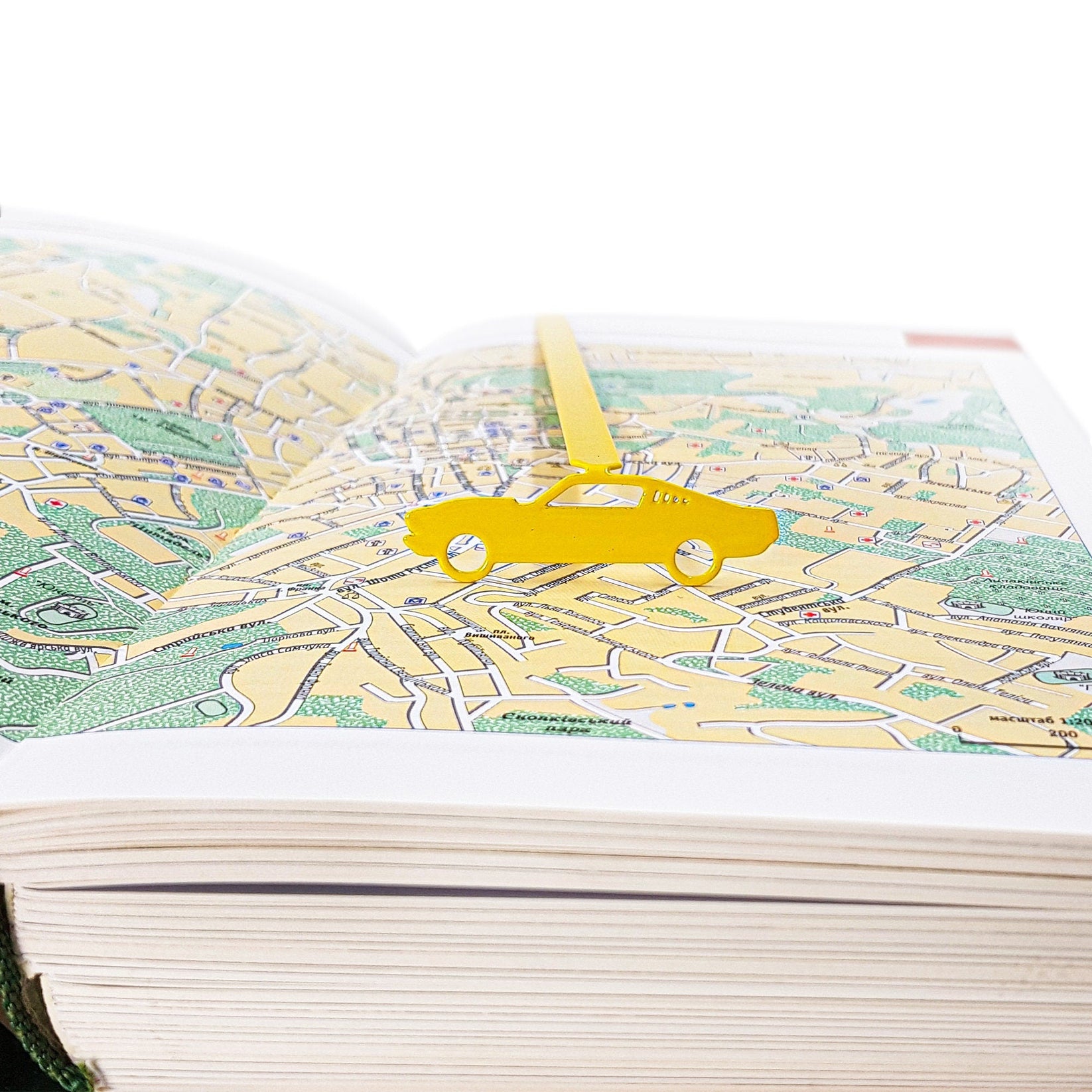 Yellow Muscle Car metal bookmark in gold against a coloured backdrop