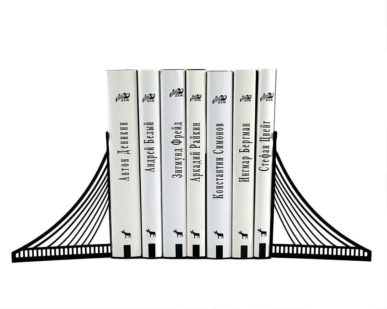 Brooklyn Bridge metal bookends holding books on a white background