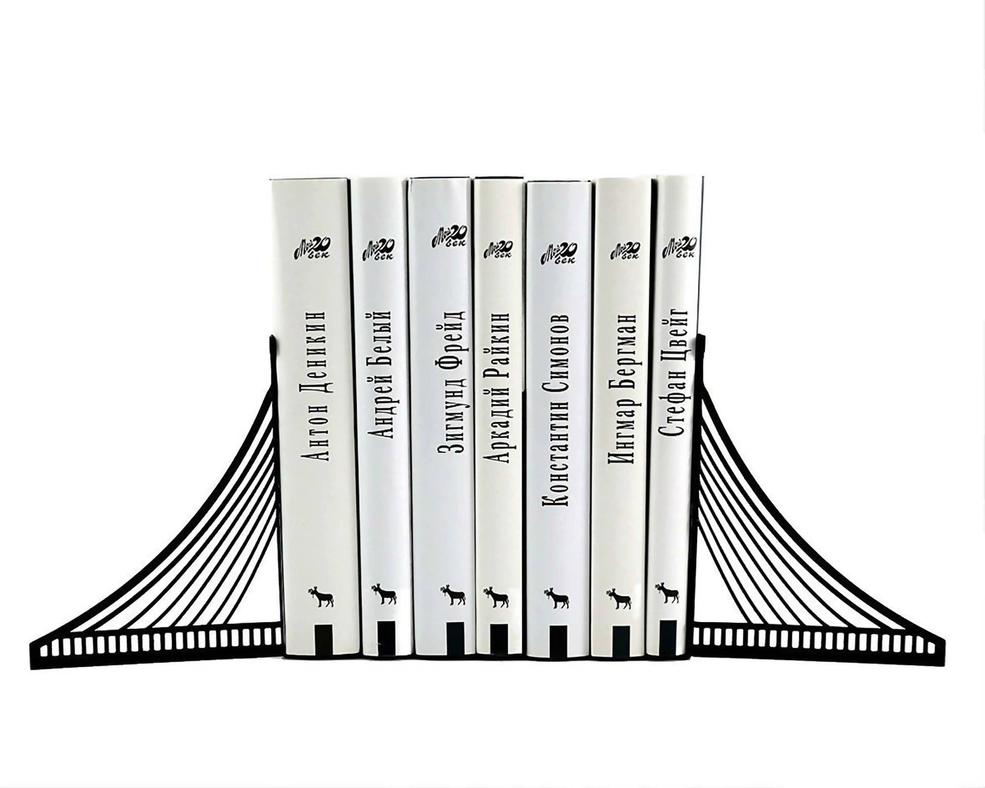 Brooklyn Bridge metal bookends holding books on a white background