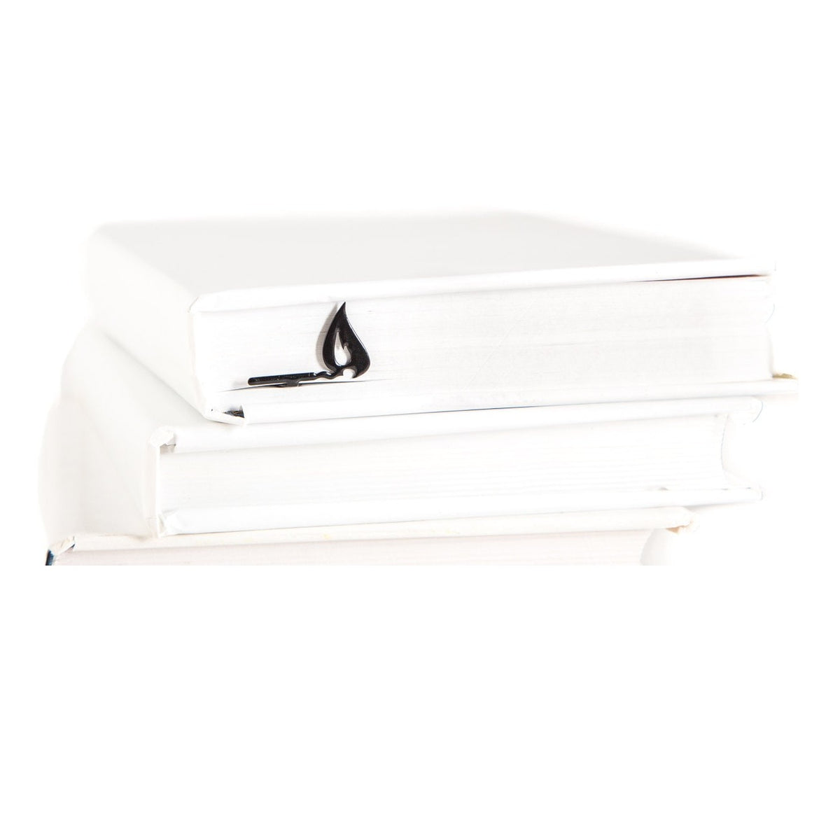 Burning Lucifer Match metal bookmark shown with a stack of books