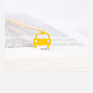 Car metal bookmark in gold shown flat on a white background